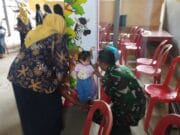 Wujud Babinsa Tawangrejo Dampingi Kegiatan Posyandu, Demi Tingkatkan Layanan Kesehatan Masyarakat