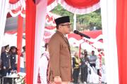 Satgas Pamtas RI-Malaysia Yonarmed 19/Bogani Ikuti Upacara Bendera HUT ke-81 Kemerdekaan RI di PLBN Entikong