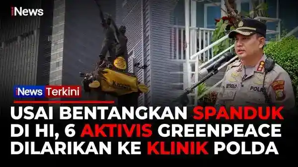 Enam Aktivis Greenpeace Dievakuasi Usai Membentangkan Spanduk di Monas HI